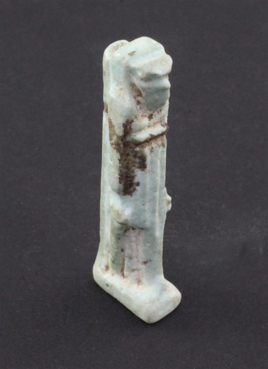 An Egyptian turquoise glazed faience amulet of Seth or Thoth, c.4th century B.C., 5cm, repaired